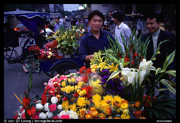 Flower vendor, night market. Leshan, Sichuan, China