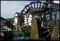 Big water wheel at the entrance of the Old Town. Lijiang, Yunnan, China (color)