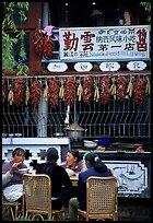 Women eat outside the Snack Food in Lijiang restaurant. Lijiang, Yunnan, China ( color)