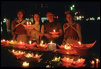 Candlelight lanters to be floated on a canal at night. Lijiang, Yunnan, China