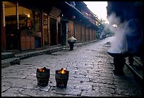 Dumplings being cooked in a cobblestone street. Lijiang, Yunnan, China