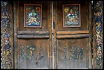 Decorated doors of a temple. Lijiang, Yunnan, China (color)