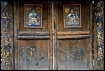 Decorated doors of a temple. Lijiang, Yunnan, China