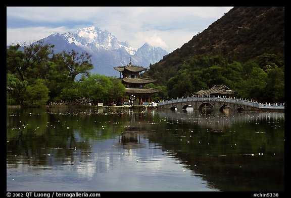 Pavillon and Jade Dragon Snow Mountains reflected in the Black Dragon Pool. Lijiang, Yunnan, China