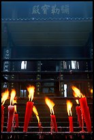 Candles burning in front of Wannian Si temple. Emei Shan, Sichuan, China