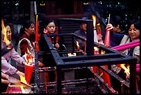 Pilgrims burning big incense batons. Emei Shan, Sichuan, China ( color)