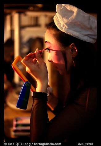 Sichuan opera actress applies makup. Chengdu, Sichuan, China (color)