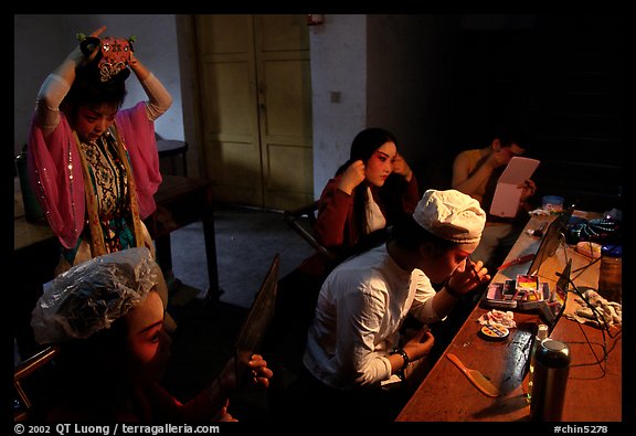 Sichuan opera actors getting ready in the backstage before the performance. Chengdu, Sichuan, China