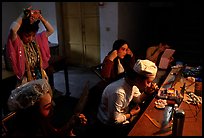 Sichuan opera actors getting ready in the backstage before the performance. Chengdu, Sichuan, China (color)