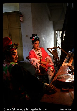 Sichuan opera actors getting ready in the backstage before the performance. Chengdu, Sichuan, China (color)