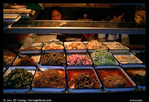 Food stall by night. Sichuan food is among China's spiciest. Chengdu, Sichuan, China (color)