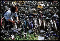 Retriving a bike in the bicycle parking lot. Chengdu, Sichuan, China (color)