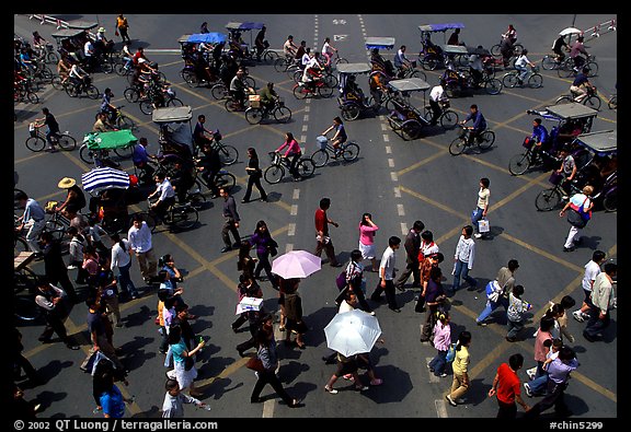 Pedestrians and bicyclists cross a major avenue. Chengdu, Sichuan, China (color)