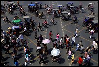 Pedestrians and bicyclists cross a major avenue. Chengdu, Sichuan, China (color)