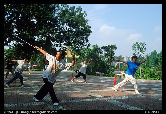 Collective exercise gymnastics with swords,  Liuha Park. Guangzhou, Guangdong, China (color)