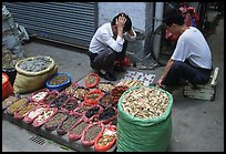 Playing Chinese chess while waiting for clients. Guangzhou, Guangdong, China ( color)