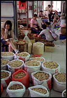 Woman selling dried food items inside the Qingping market. Guangzhou, Guangdong, China