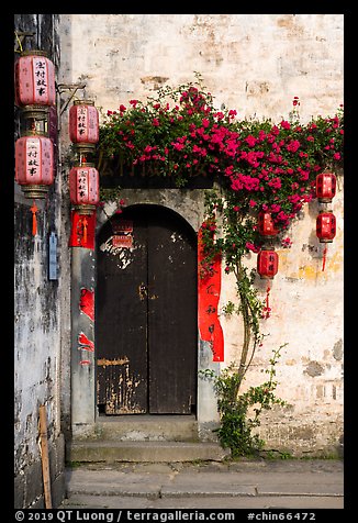 Wooden door with lanterns and flowers. Hongcun Village, Anhui, China (color)