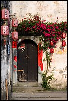 Wooden door with lanterns and flowers. Hongcun Village, Anhui, China