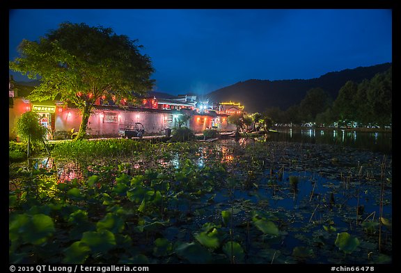 Houses reflected in South Lake at night. Hongcun Village, Anhui, China (color)