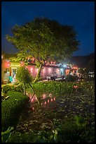 Houses reflected in Nanhu Lake at night. Hongcun Village, Anhui, China