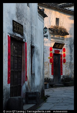 Morning light streaming on walls with lanterns. Xidi Village, Anhui, China (color)