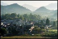 Village and hills in morning fog. Xidi Village, Anhui, China ( color)