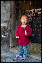 Boy with toothbrush. Xidi Village, Anhui, China ( color)