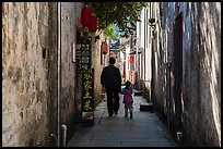 Father and daughter walking in alley. Xidi Village, Anhui, China ( color)