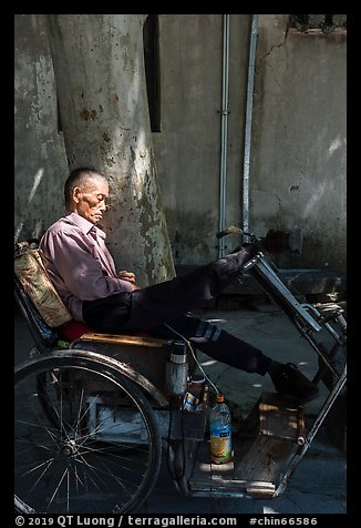 Man sleeping on cyclo. Xidi Village, Anhui, China (color)