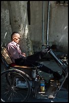 Man sleeping on cyclo. Xidi Village, Anhui, China