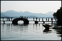 People walking on Yongjin Bridge, West Lake. Hangzhou, China