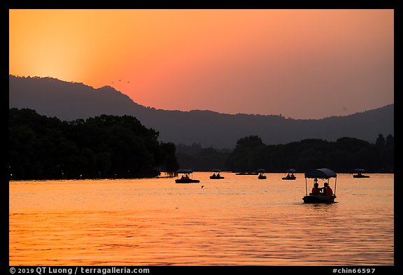 Boats on West Lake at sunset. Hangzhou, China