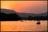 Boats on West Lake at sunset. Hangzhou, China