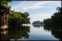 Tree-lined shores and pavilion, West Lake. Hangzhou, China