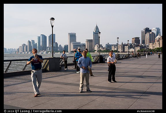 Men flying kites, the Bund. Shanghai, China (color)