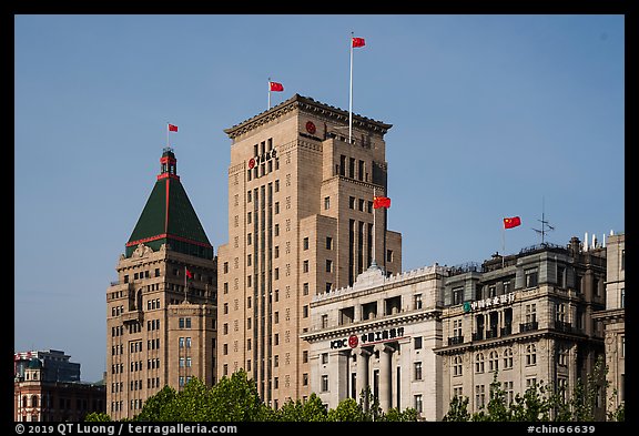 Colonial area buildings with Chinese flags. Shanghai, China (color)