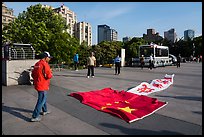 Man with kite on the ground, the Bund. Shanghai, China ( color)