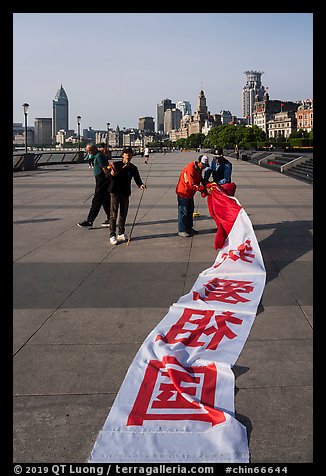 Men folding kite, the Bund. Shanghai, China (color)