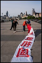 Men folding kite, the Bund. Shanghai, China ( color)