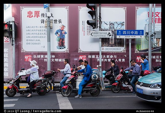 Motercycle riders waiting at trafic light. Shanghai, China (color)
