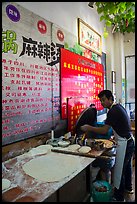 Man preparing breakfast pancakes. Shanghai, China ( color)