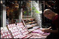 Man shopping at Bird and Insect Market. Shanghai, China ( color)