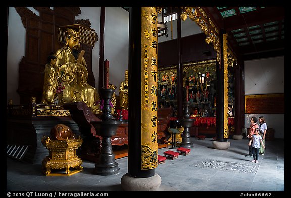 Family visiting Dajing Taoist temple. Shanghai, China (color)