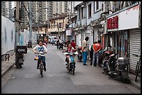 Old Street lined with old buidings and modern towers. Shanghai, China ( color)