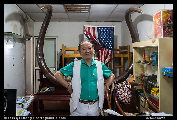 Ivory merchant with mammoth tusk. Shanghai, China (color)