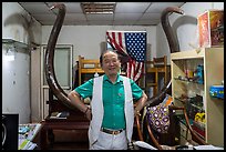 Ivory merchant with mammoth tusk. Shanghai, China ( color)