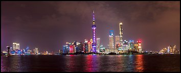 Shanghai city skyline from the Bund at night. Shanghai, China (Panoramic color)