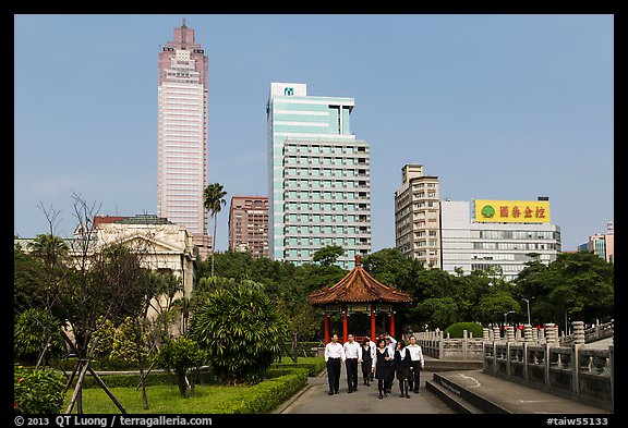 Office workers, 2-28 Peace Park, and high rises. Taipei, Taiwan (color)