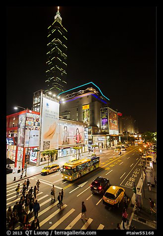 Shopping district street at night and Taipei 101. Taipei, Taiwan